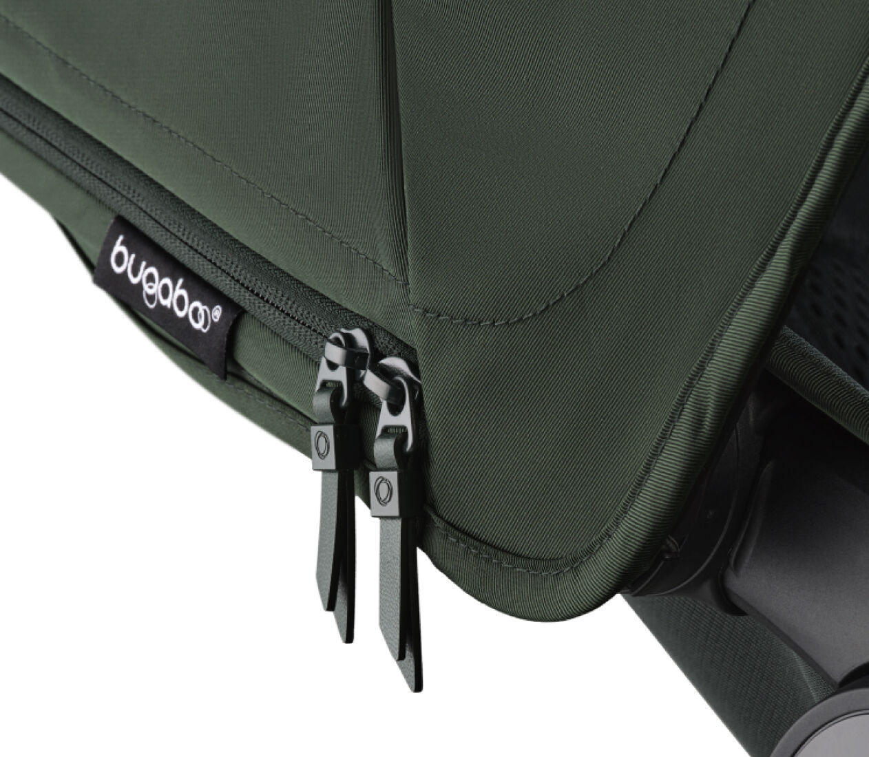Close up on a Bugaboo sun canopy, with focus on the zippers and the Bugaboo brand label.