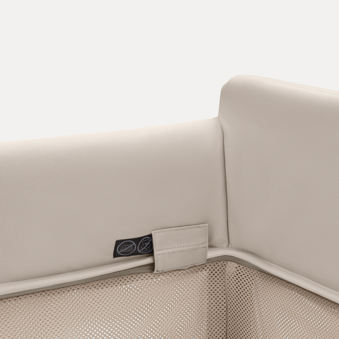 Close-up of the sleek finishes of the Bugaboo Stardust travel cot in Desert Taupe colourway.