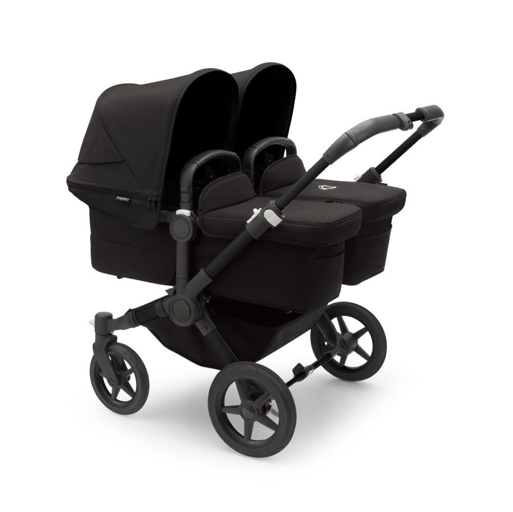 A Bugaboo Donkey 5 Twin stroller with two bassinets.