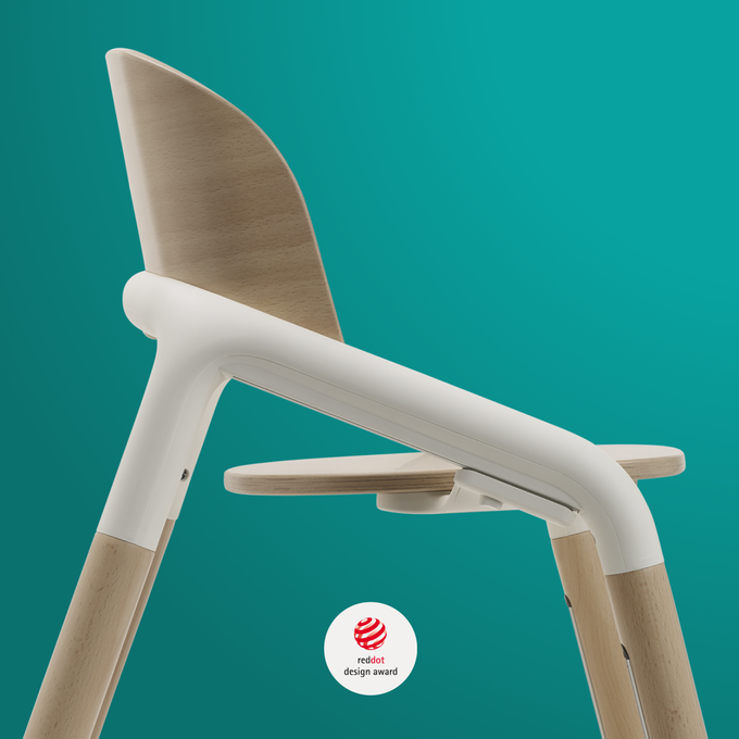 Side view of the top half of the Bugaboo Giraffe chair, in warm wood/white colour.