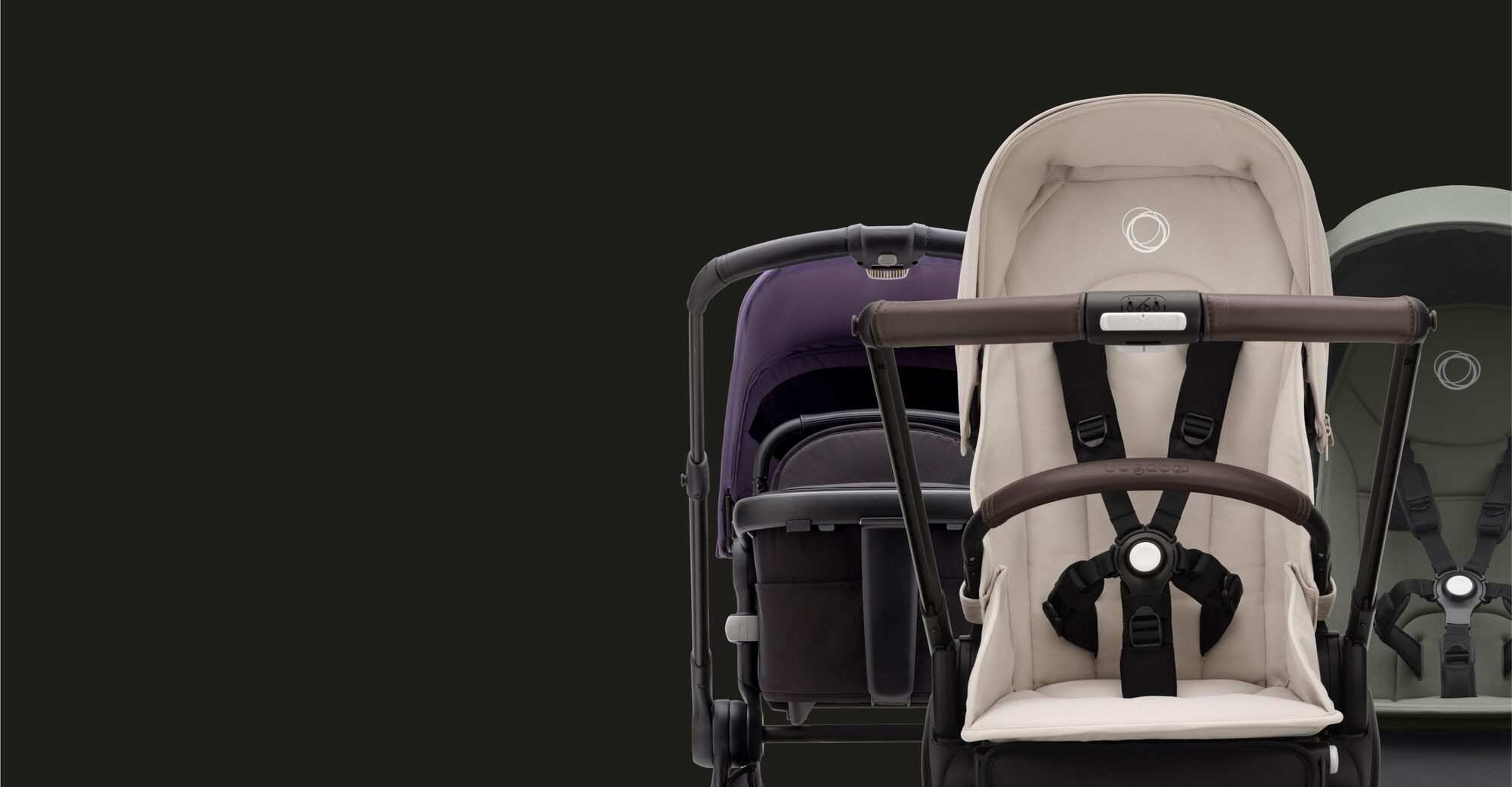 A lineup of a Bugaboo Dragonfly in Misty White fabrics, a Bugaboo Fox 5 in Astro Purple sun canopy, and a Bugaboo Butterfly in Forest Green fabrics