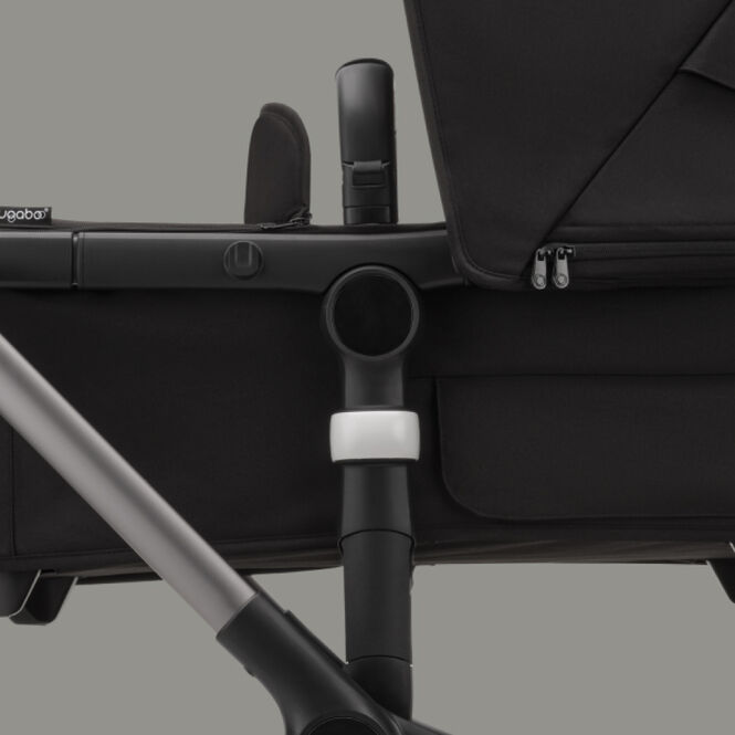 Close up on the Bugaboo carrycot height adapter, raising the carrycot higher from the ground.