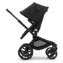 Side view of the Bugaboo Fox 5 seat pushchair with black chassis, midnight black fabrics and midnight black sun canopy. - Thumbnail Slide 4 of 16
