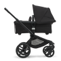 Side view of the Bugaboo Fox 5 carrycot pushchair with black chassis, midnight black fabrics and midnight black sun canopy. - Thumbnail Slide 3 of 16